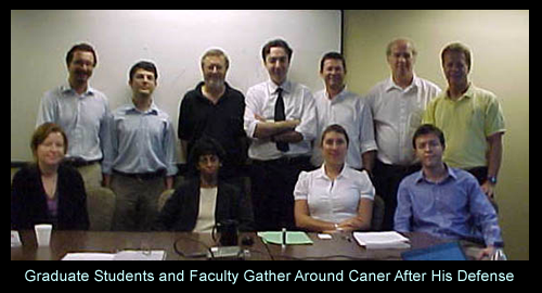 grad_students_and_faculty_gather_around_caner_after_his_defe