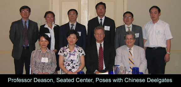 professor_deason_seated_center_poses_with_chinese_deelgate