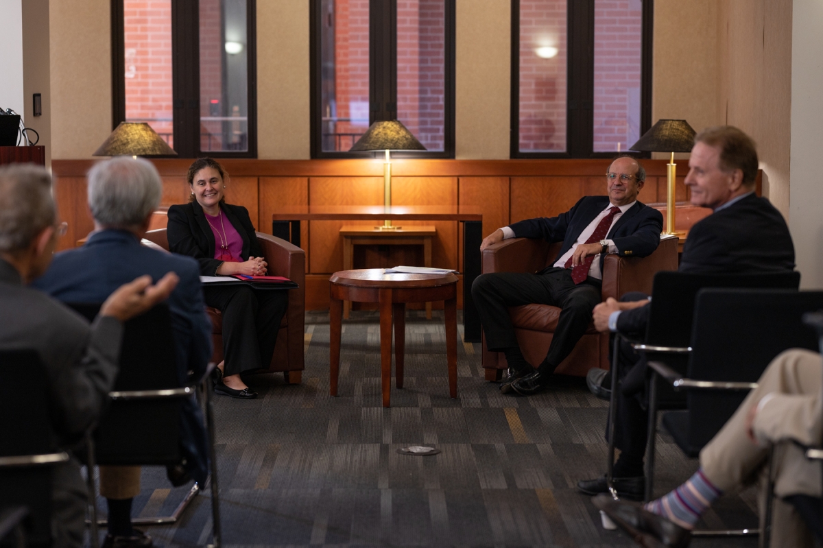 group of people sitting in discussion