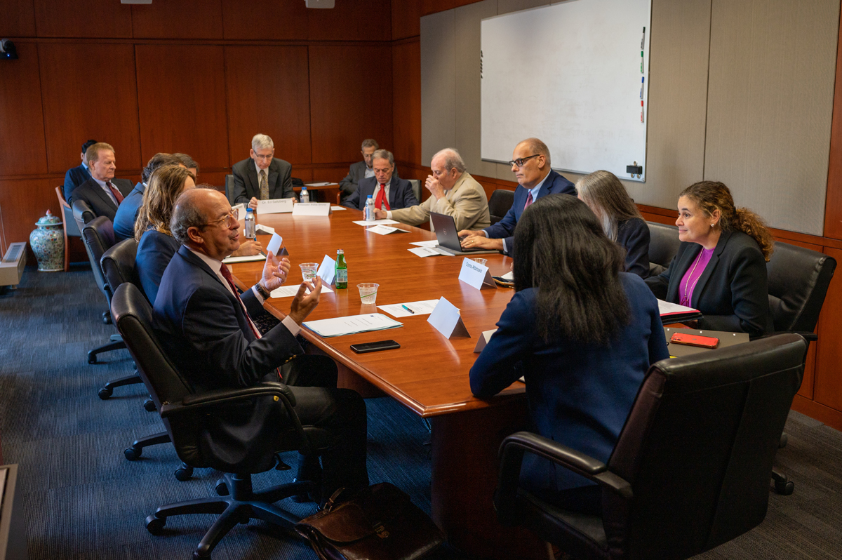 group speaking around a conference table