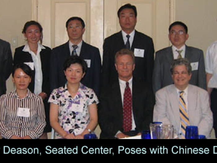 professor_deason_seated_center_poses_with_chinese_deelgate